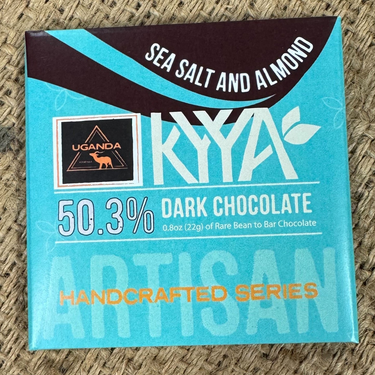 KYRA dark chocolate bar packaging on a textured surface