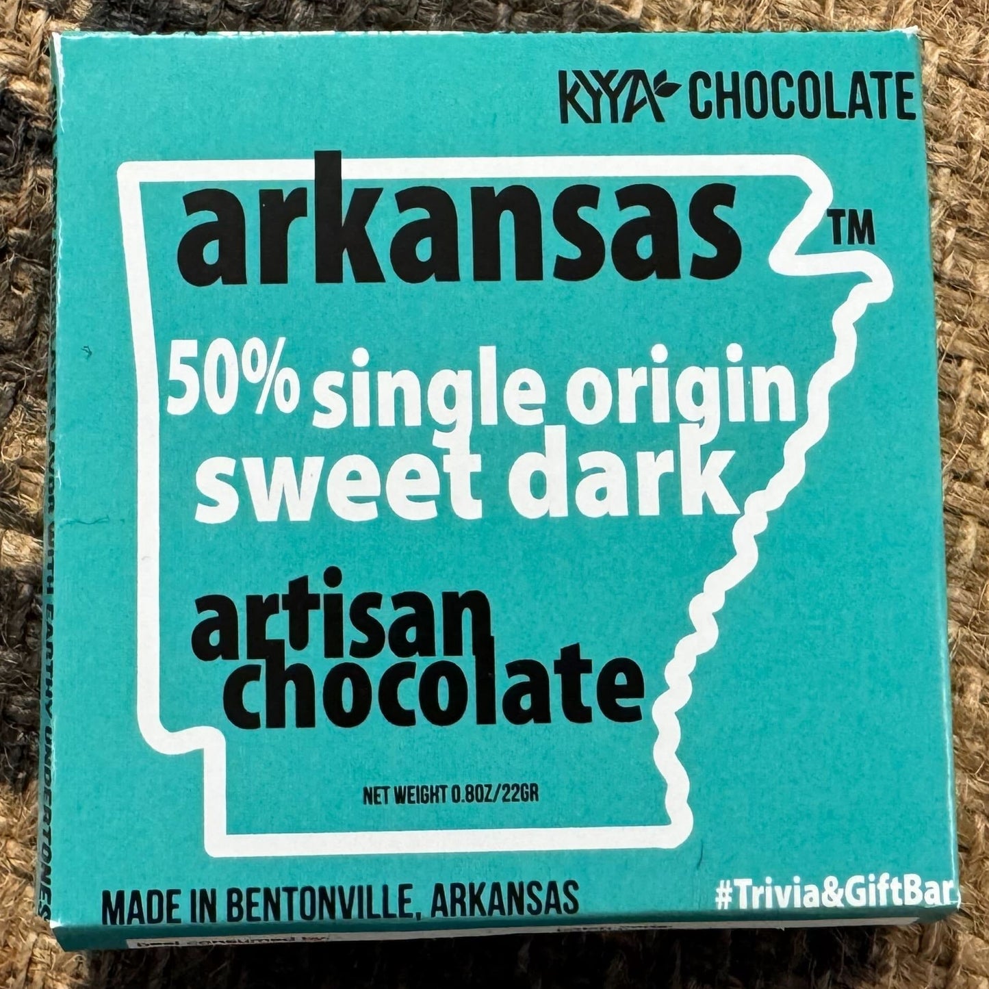 Arkansas artisan chocolate bar packaging on a textured surface